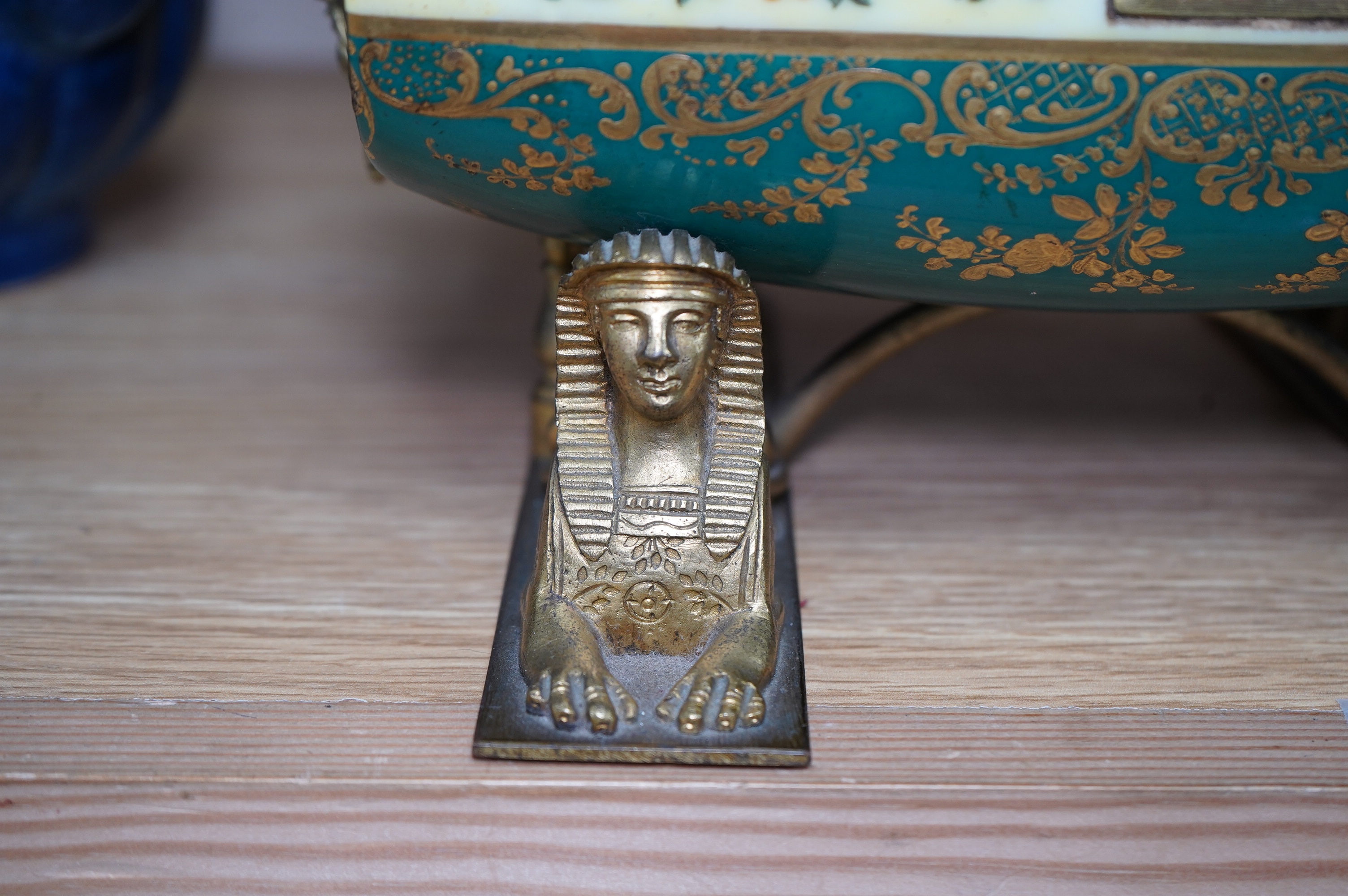 An early 20th century Sevres style sarcophagus shaped casket, on twin sphinx ormolu base, 24cm. Condition - good